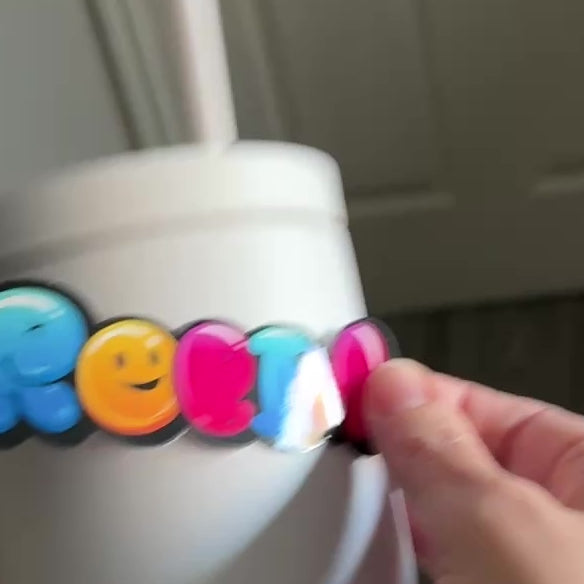 Applying personalised graffiti Bubble Balloon Name Sticker to a dink bottle vinyl