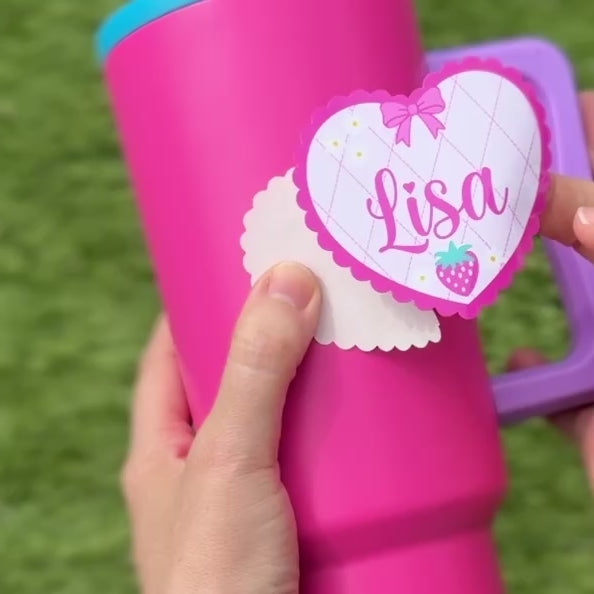 Heart shaped coquette Strawberry Name Personalised Waterproof Vinyl Sticker applied to a drink bottle